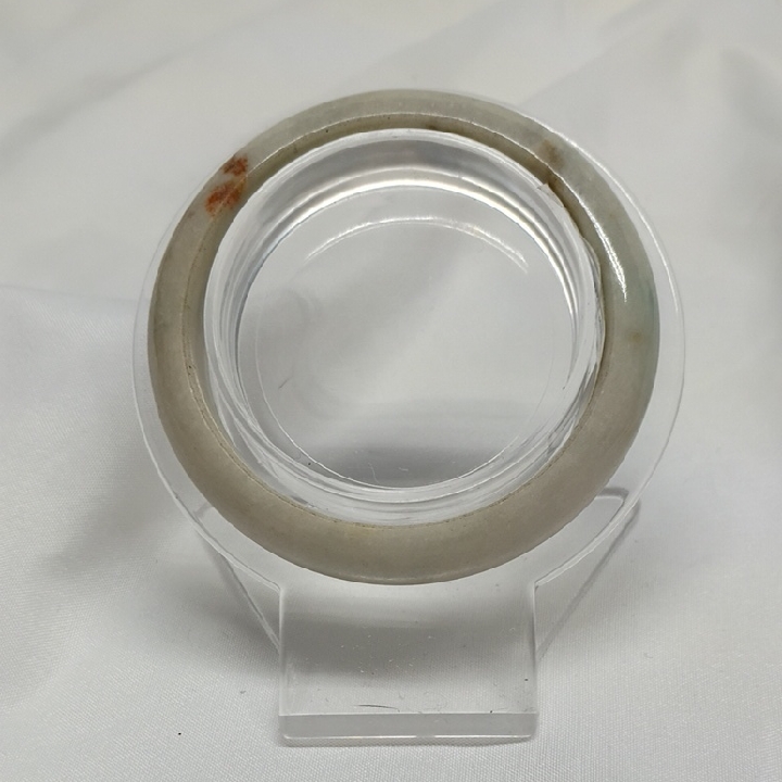 A jadeite bangle listed at $80.00 on a US resale marketplace in September 2026